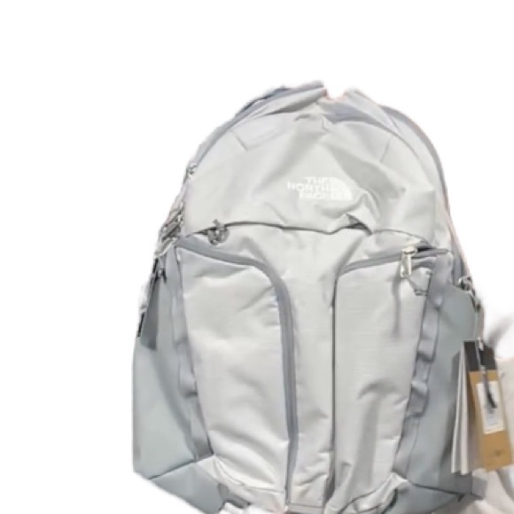 dark grey and blue north face backpack Surge Backpack - 31L